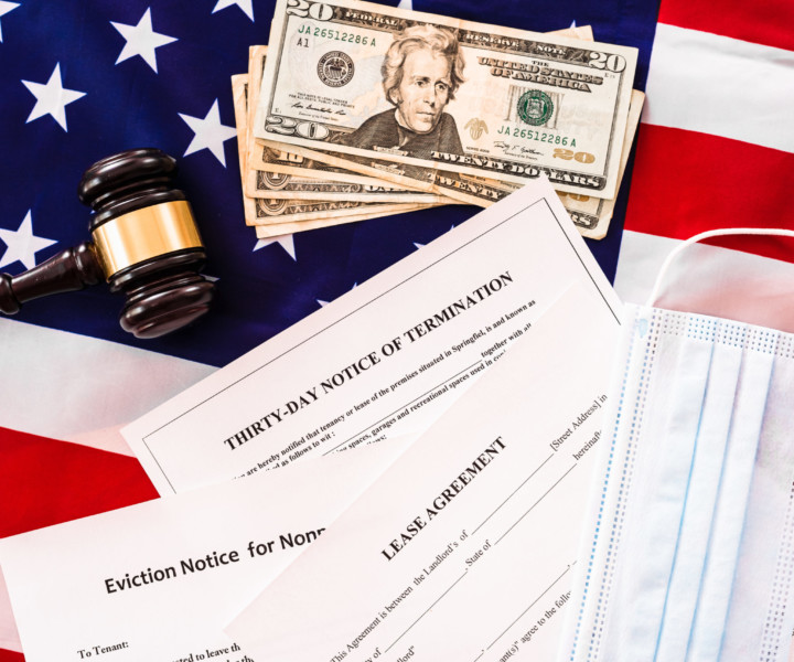 The coronavirus pandemic has harmed those who must pay their rent, document background with gavel and American flag.
